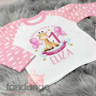 Personalised 1st birthday giraffe pyjamas - pink cloud sleeves